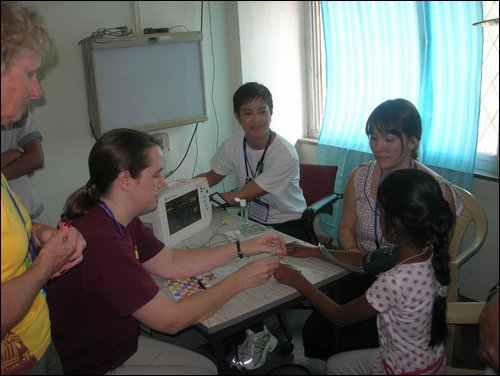 Operation Smile team screening the patients.JPG