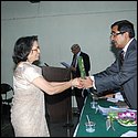 Rotarian Mrs Agrawala receiving token of appreciaciation.JPG